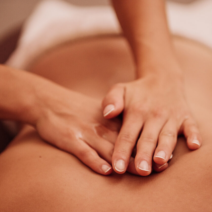 woman getting a back massage at a spa
Photo taken indoors with stobe light